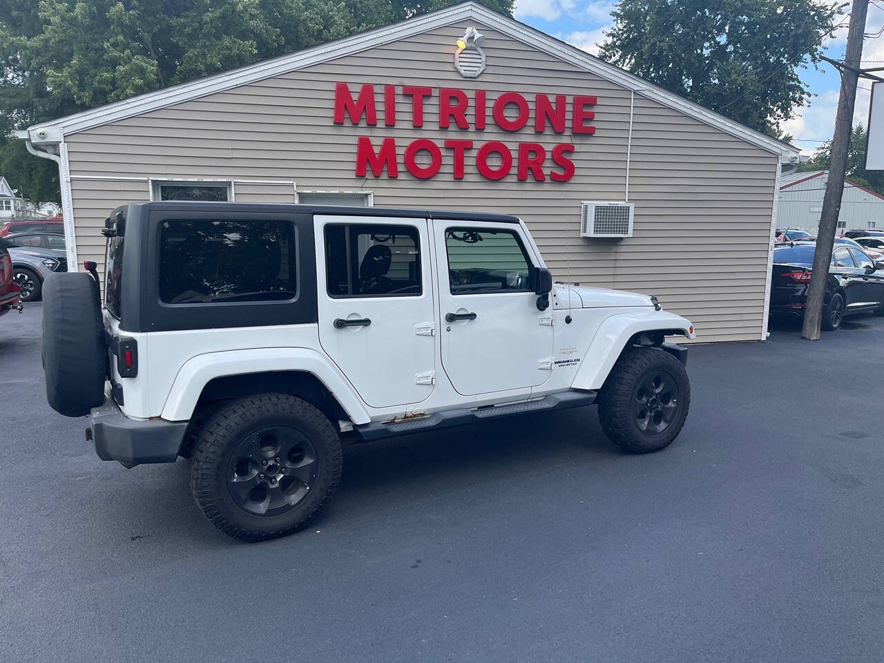 2013 Jeep Wrangler Unlimited for sale at Mitrione Motors in Springfield, IL