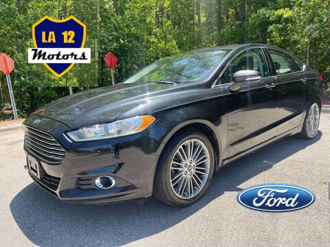 2013 Ford Fusion for sale at LA 12 Motors in Durham NC
