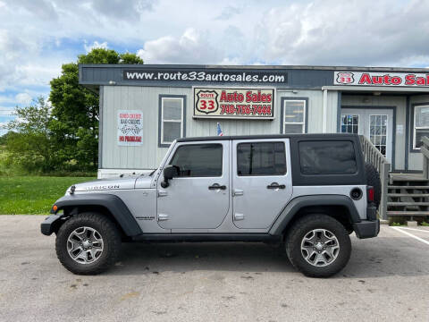 2013 Jeep Wrangler Unlimited for sale at Route 33 Auto Sales in Carroll OH