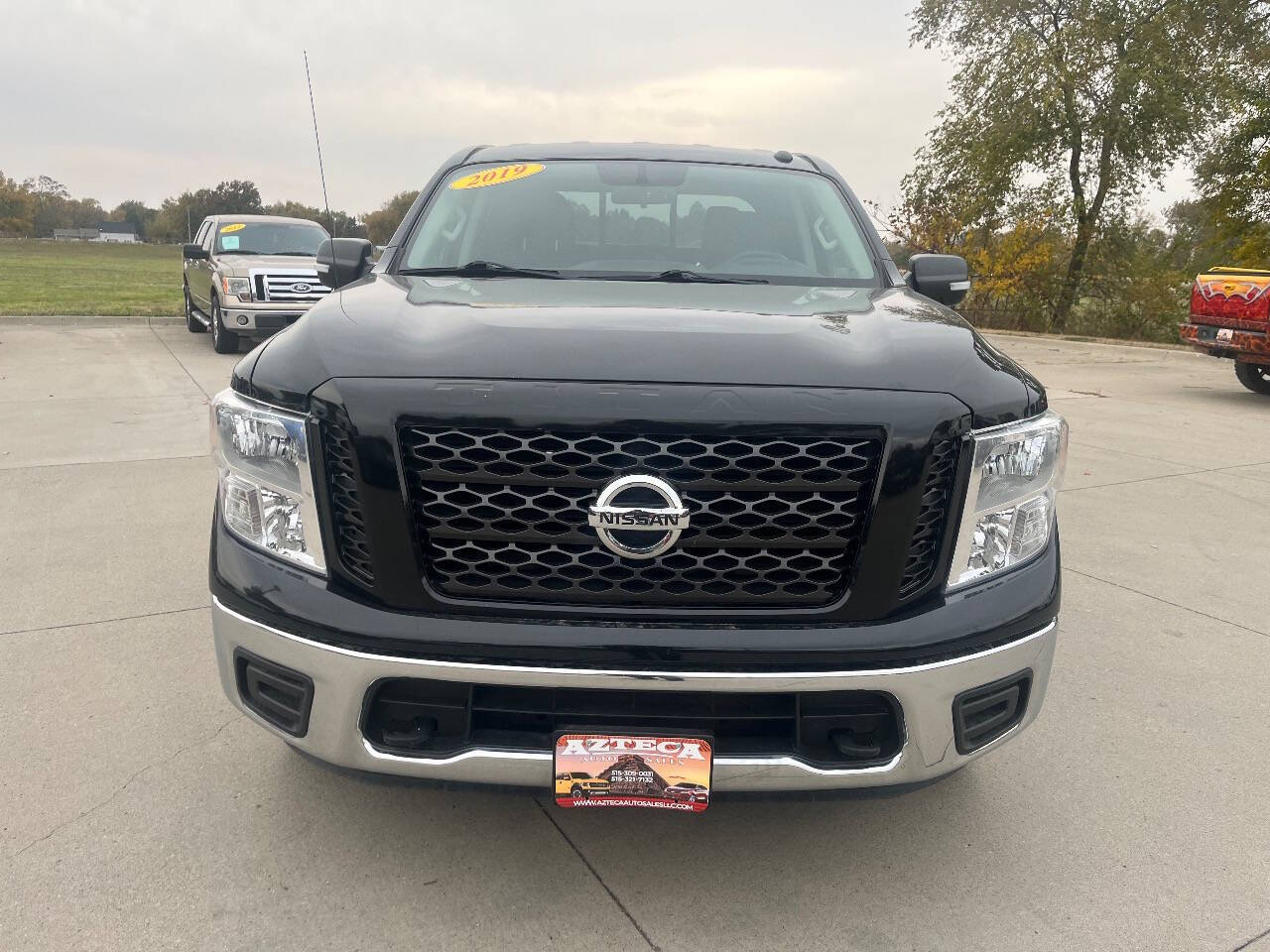 Black 2019 Nissan Titan SL 4x4 SL 4dr Crew Cab 2