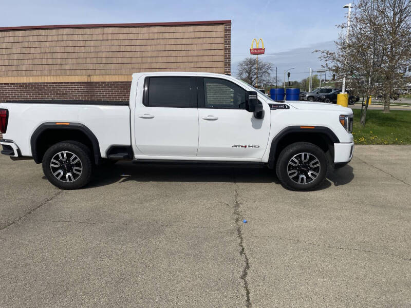 Used 2023 GMC Sierra 2500HD AT4 with VIN 1GT49PE73PF150875 for sale in Maquoketa, IA