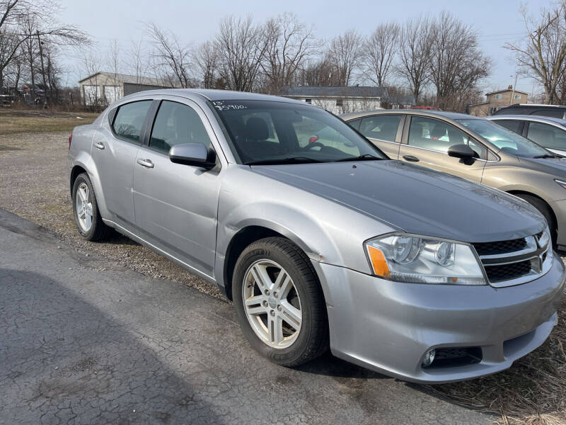 2013 Dodge Avenger for sale at HEDGES USED CARS in Carleton MI