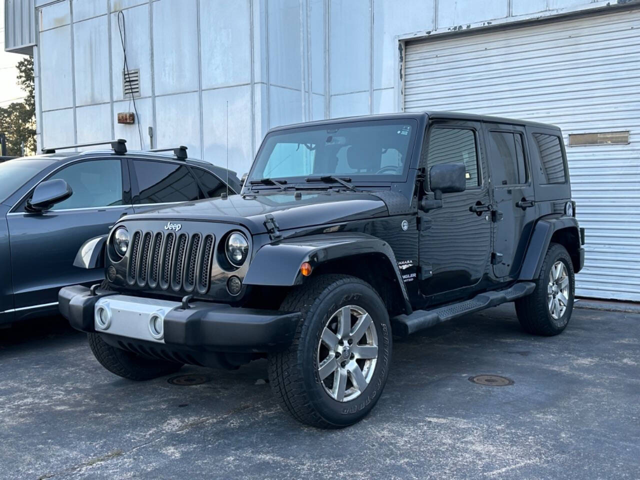 2013 Jeep Wrangler Unlimited for sale at Prompt Luxury Cars LLC in Austell, GA