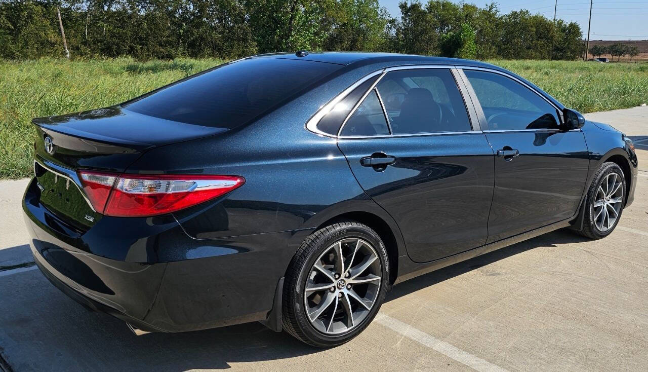 2015 Toyota Camry for sale at CAR MARKET AUTO GROUP in Sugar Land, TX