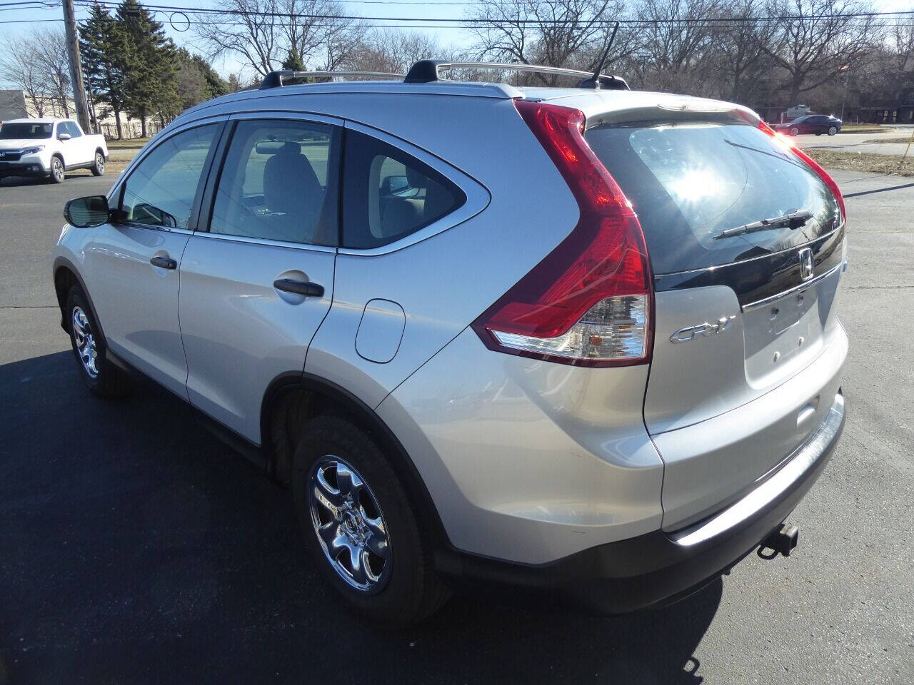 2012 Honda CR-V for sale at Lakeshore Autos in Holland, MI