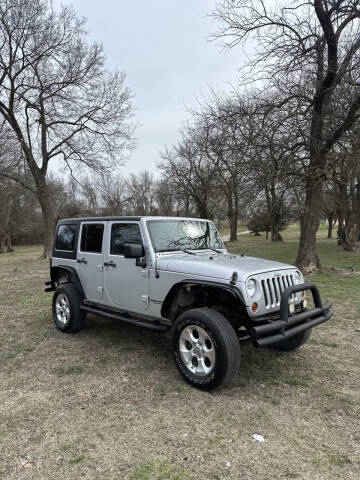 2011 Jeep Wrangler Unlimited for sale at JE AUTO SALES LLC in Webb City MO