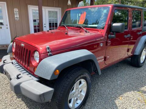 2012 Jeep Wrangler Unlimited for sale at Suburban Wrench in Pennington NJ