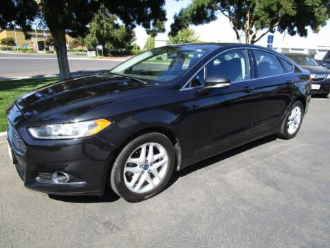2014 Ford Fusion for sale at KM MOTOR CARS in Modesto CA