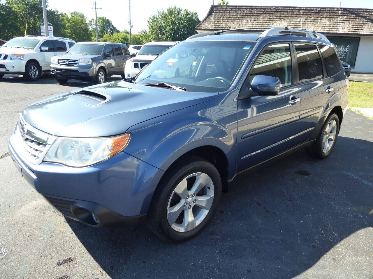 2011 Subaru Forester for sale at Lakeshore Autos in Holland, MI