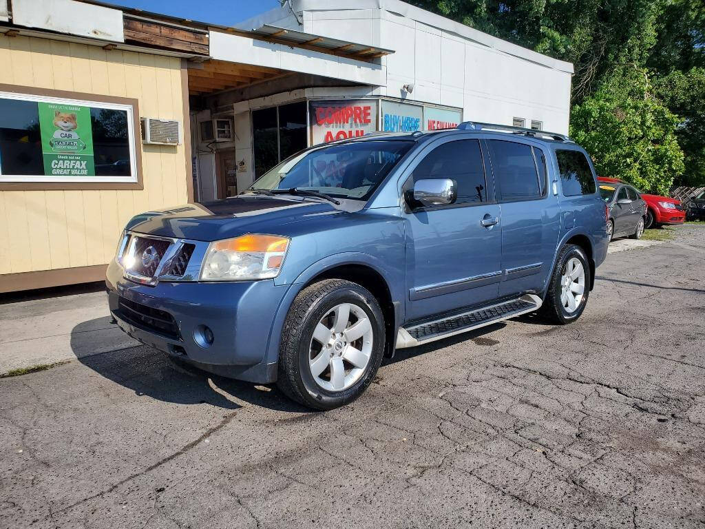 2010 Nissan Armada for sale at DAGO'S AUTO SALES LLC in Dalton, GA