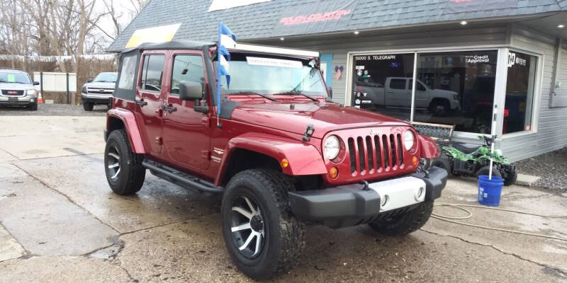 2012 Jeep Wrangler Unlimited for sale at Kevin Lapp Motors in Plymouth MI