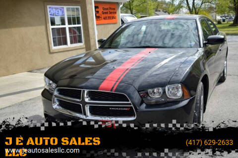 2014 Dodge Charger for sale at JE AUTO SALES LLC in Webb City MO