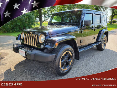 2014 Jeep Wrangler Unlimited for sale at Lifetime Auto Sales and Service in West Bend WI