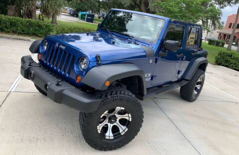 2009 Jeep Wrangler Unlimited for sale at PennSpeed in New Smyrna Beach FL