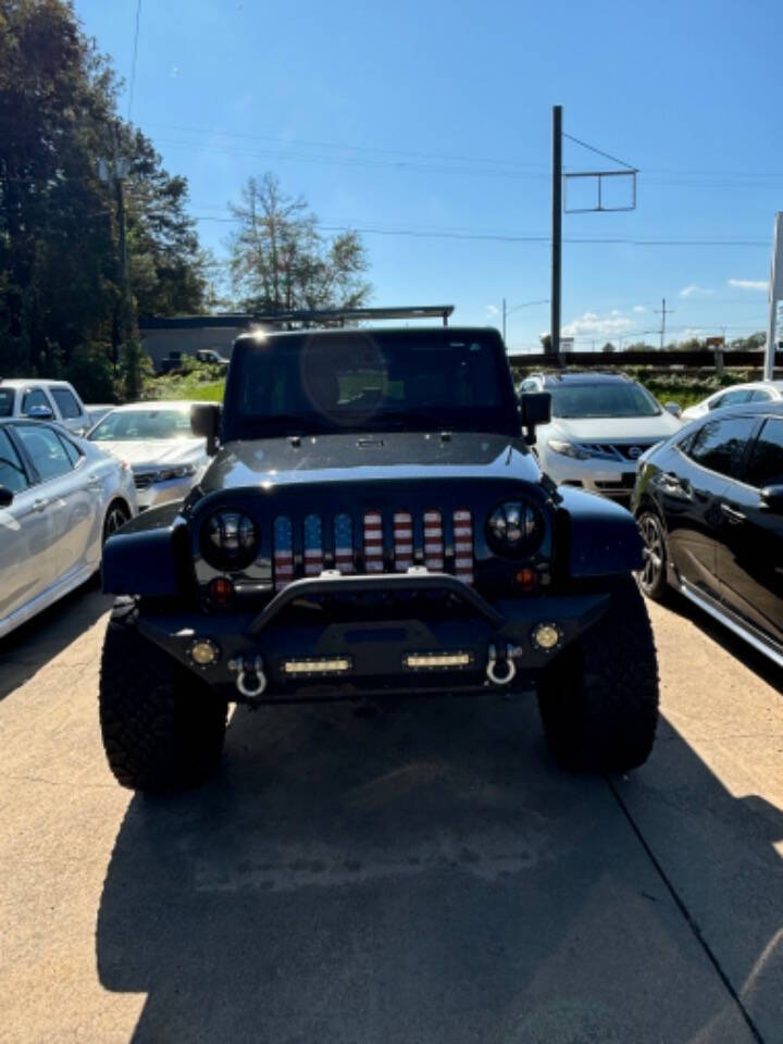 2013 Jeep Wrangler Unlimited for sale at Good Cars and Trucks Wholesale, LLC in Crystal Springs, MS