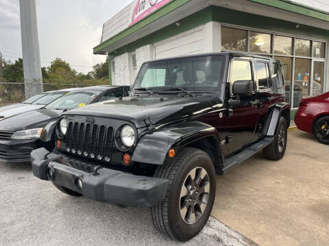 2012 Jeep Wrangler Unlimited for sale at Auto Outlet Inc. in Houston TX