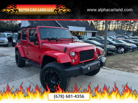 2014 Jeep Wrangler Unlimited for sale at Alpha Car Land LLC in Snellville GA