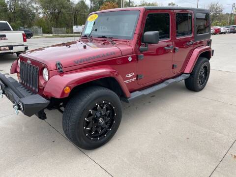 2011 Jeep Wrangler Unlimited for sale at Azteca Auto Sales LLC in Des Moines IA