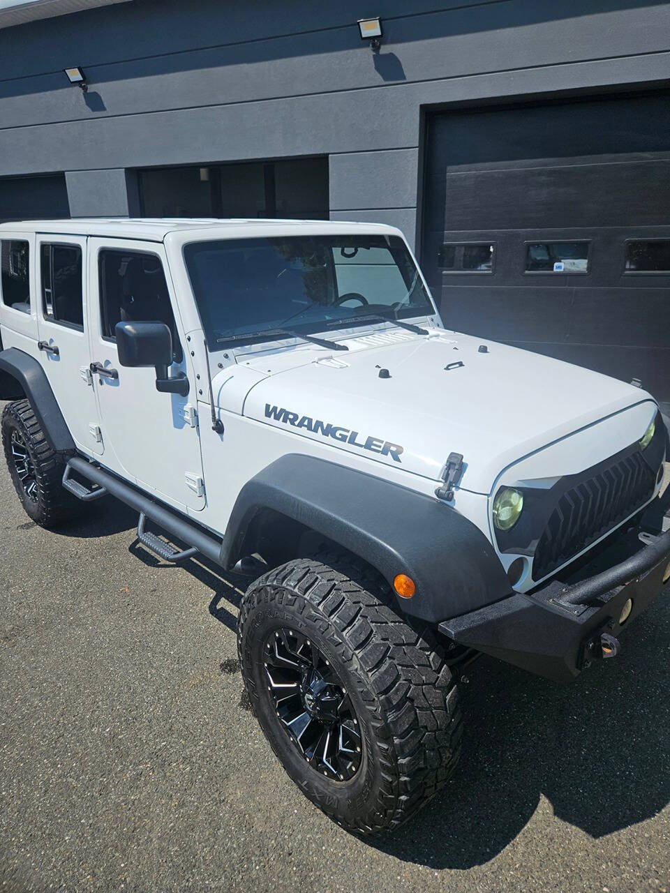 2016 Jeep Wrangler Unlimited for sale at RENOS AUTO SALES LLC in Waterbury, CT