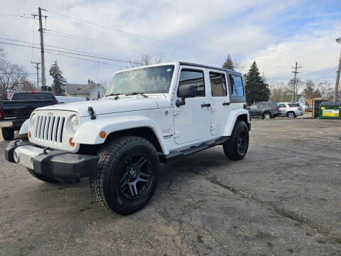 2012 Jeep Wrangler Unlimited for sale at DALE'S AUTO INC in Mount Clemens MI