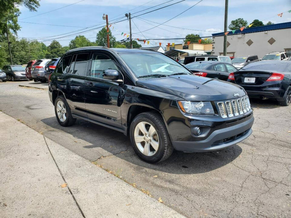 2016 Jeep Compass for sale at DAGO'S AUTO SALES LLC in Dalton, GA