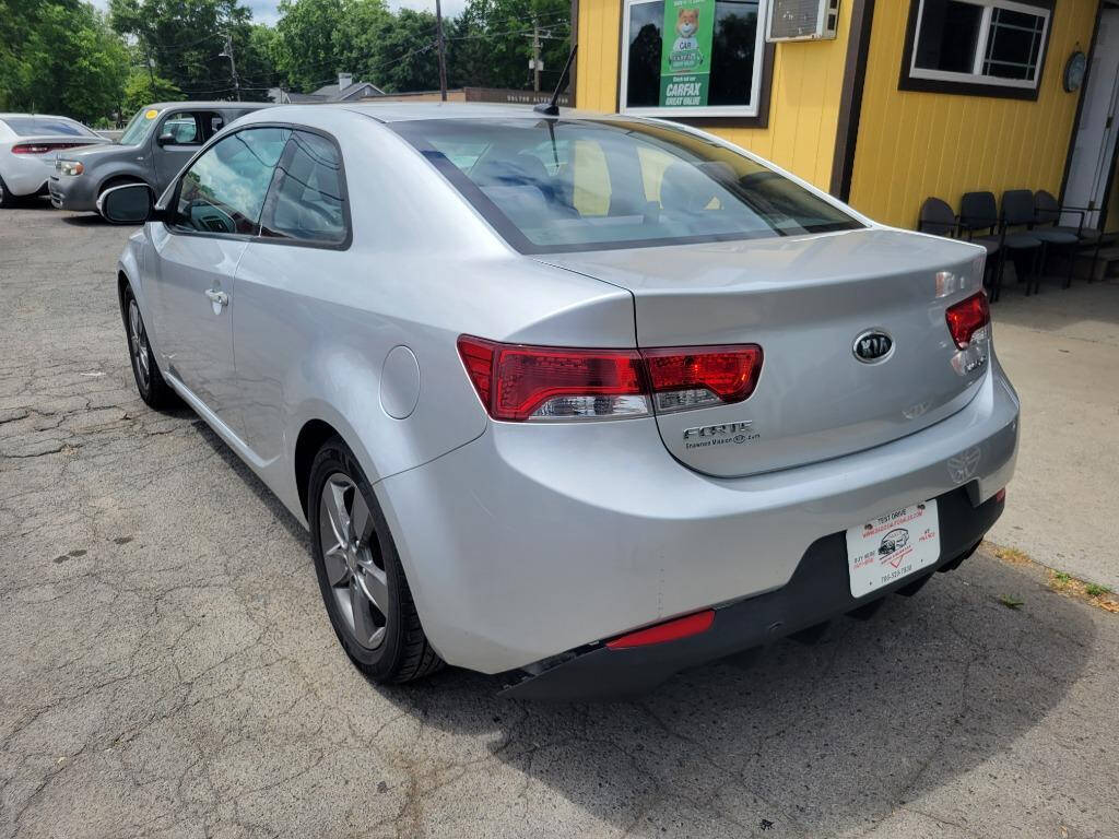 2010 Kia Forte Koup for sale at DAGO'S AUTO SALES LLC in Dalton, GA