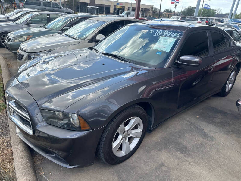 2014 Dodge Charger for sale at Buy-Fast Autos in Houston TX