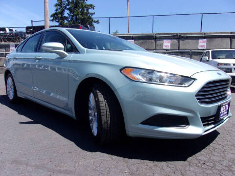 2013 Ford Fusion Hybrid for sale at Delta Auto Sales in Milwaukie OR