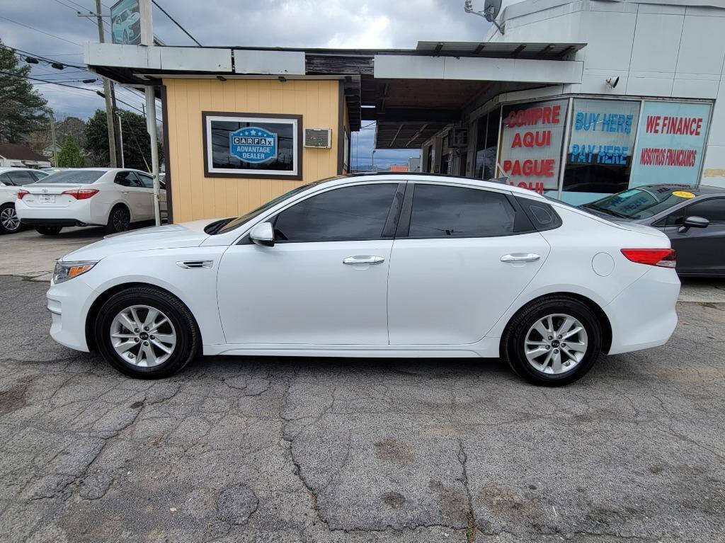 2016 Kia Optima for sale at DAGO'S AUTO SALES LLC in Dalton, GA