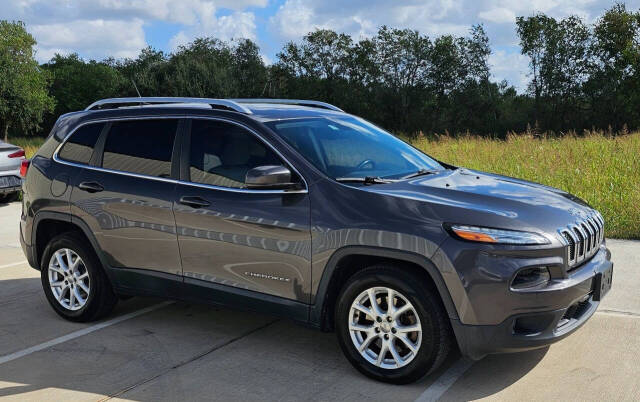 2017 Jeep Cherokee for sale at CAR MARKET AUTO GROUP in Sugar Land, TX