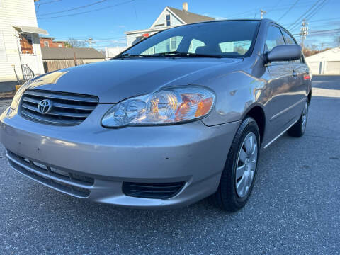 2003 Toyota Corolla for sale at D'Ambroise Auto Sales in Lowell MA