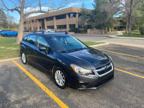 2014 Subaru Impreza for sale at QUEST MOTORS in Englewood CO