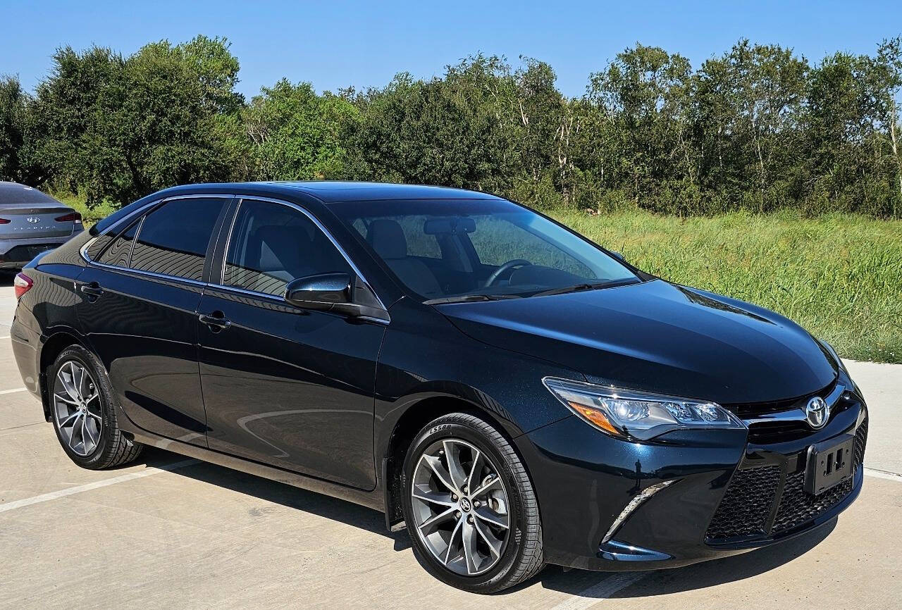 2015 Toyota Camry for sale at CAR MARKET AUTO GROUP in Sugar Land, TX