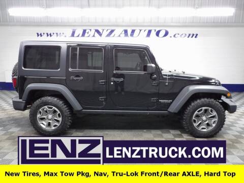 2014 Jeep Wrangler Unlimited for sale at LENZ TRUCK CENTER in Fond Du Lac WI