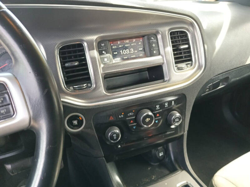 2014 Dodge Charger for sale at Taylor Trading Co in Beaumont TX