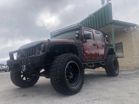2009 Jeep Wrangler Unlimited for sale at B & J Auto Sales in Auburn KY