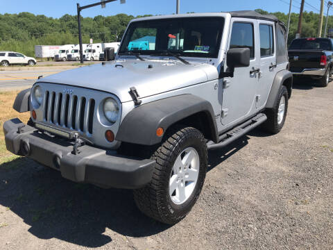2011 Jeep Wrangler Unlimited for sale at Rinaldi Auto Sales Inc in Taylor PA