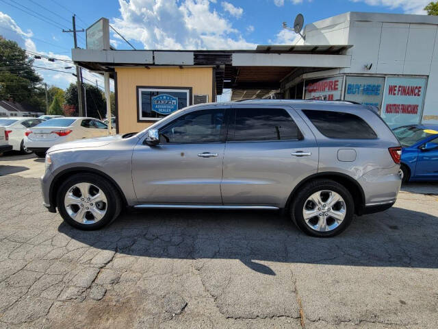 2014 Dodge Durango for sale at DAGO'S AUTO SALES LLC in Dalton, GA