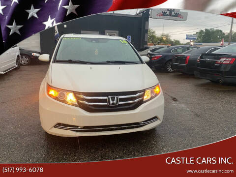 2014 Honda Odyssey for sale at Castle Cars Inc. in Lansing MI