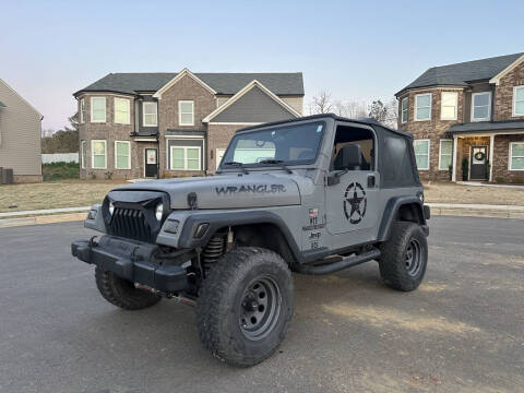 2002 Jeep Wrangler for sale at Alpha Car Land LLC in Snellville GA