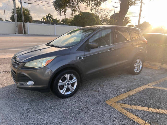 2014 Ford Escape for sale at M & J UNITED AUTO SALES in LAUDERDALE LAKES, FL