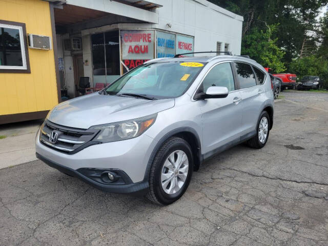 2014 Honda CR-V for sale at DAGO'S AUTO SALES LLC in Dalton, GA