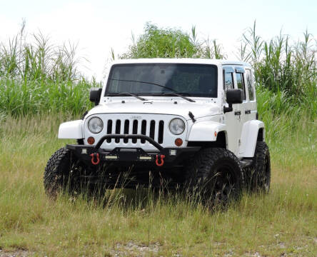 2011 Jeep Wrangler Unlimited for sale at Auto Whim in Miami FL