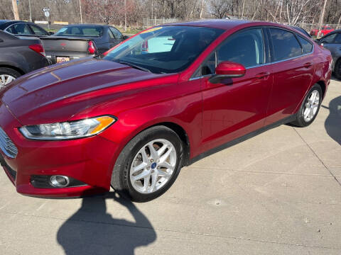 2014 Ford Fusion for sale at Azteca Auto Sales LLC in Des Moines IA