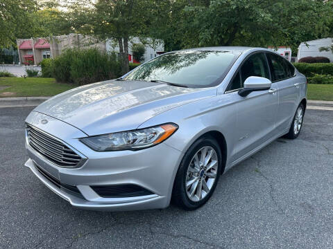 2017 Ford Fusion Hybrid for sale at Triangle Motors Inc in Raleigh NC
