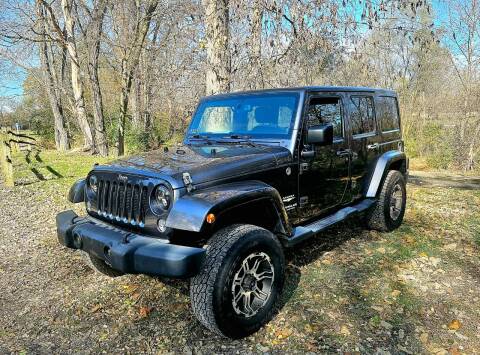 2014 Jeep Wrangler Unlimited for sale at GOLDEN RULE AUTO in Newark OH