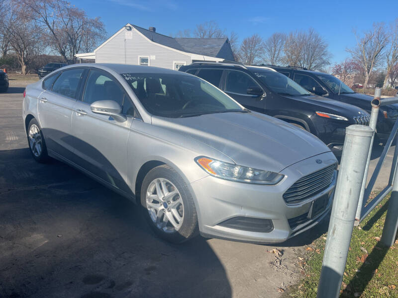 2013 Ford Fusion for sale at HEDGES USED CARS in Carleton MI
