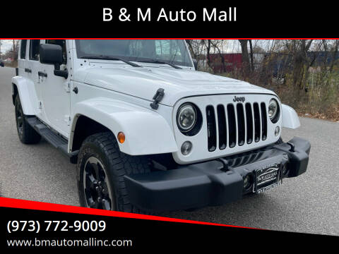 2014 Jeep Wrangler Unlimited for sale at B & M Auto Mall in Clifton NJ