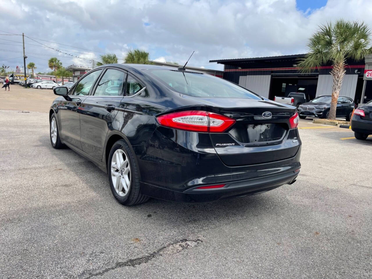 2014 Ford Fusion for sale at SMART CHOICE AUTO in Pasadena, TX