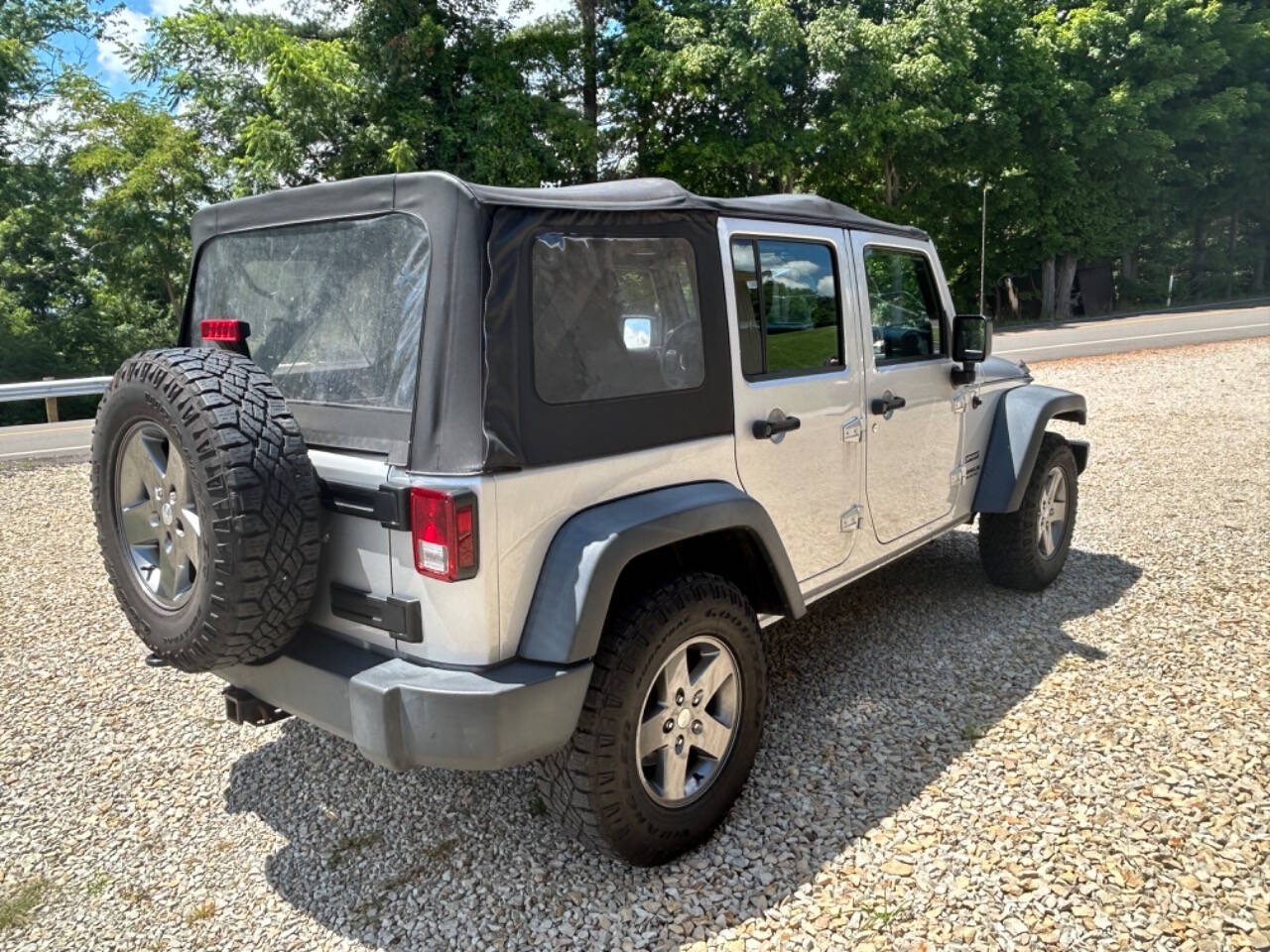 2012 Jeep Wrangler Unlimited for sale at STRODES AUTO GROUP LLP in Malta, OH